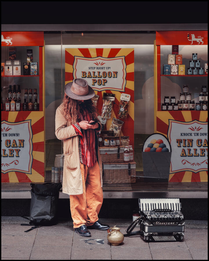 Photo of a busker setting up